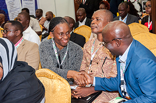 ASSP members shake hands while seated at a presentation